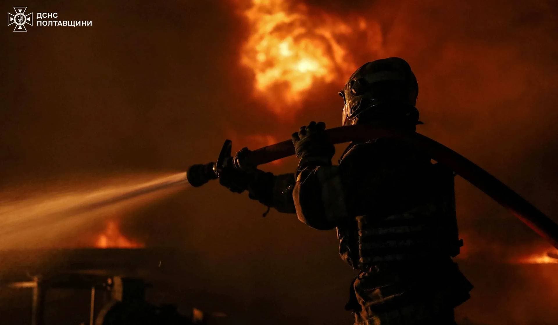 A firefighter works at the site of a Russian drone strike in Poltava Region