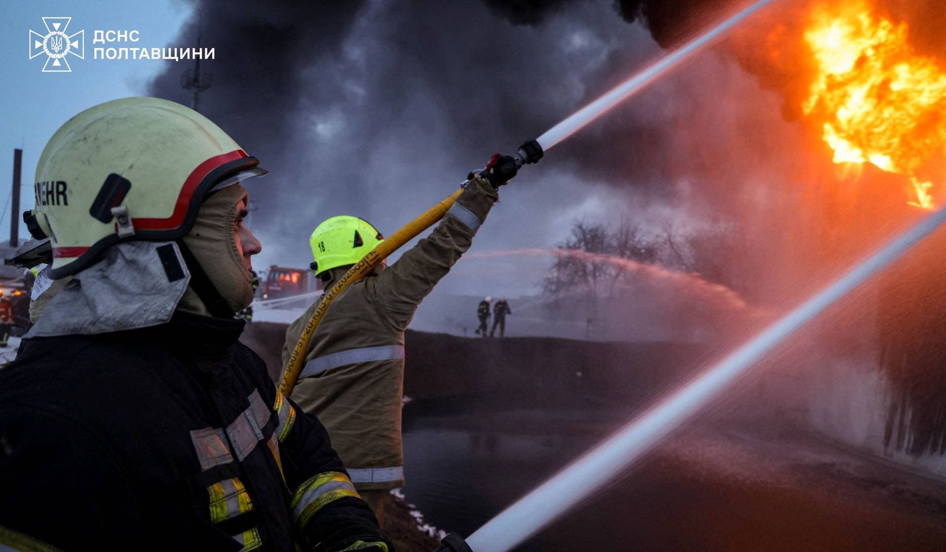 Firefighters work at the site of a Russian strike in Poltava Region