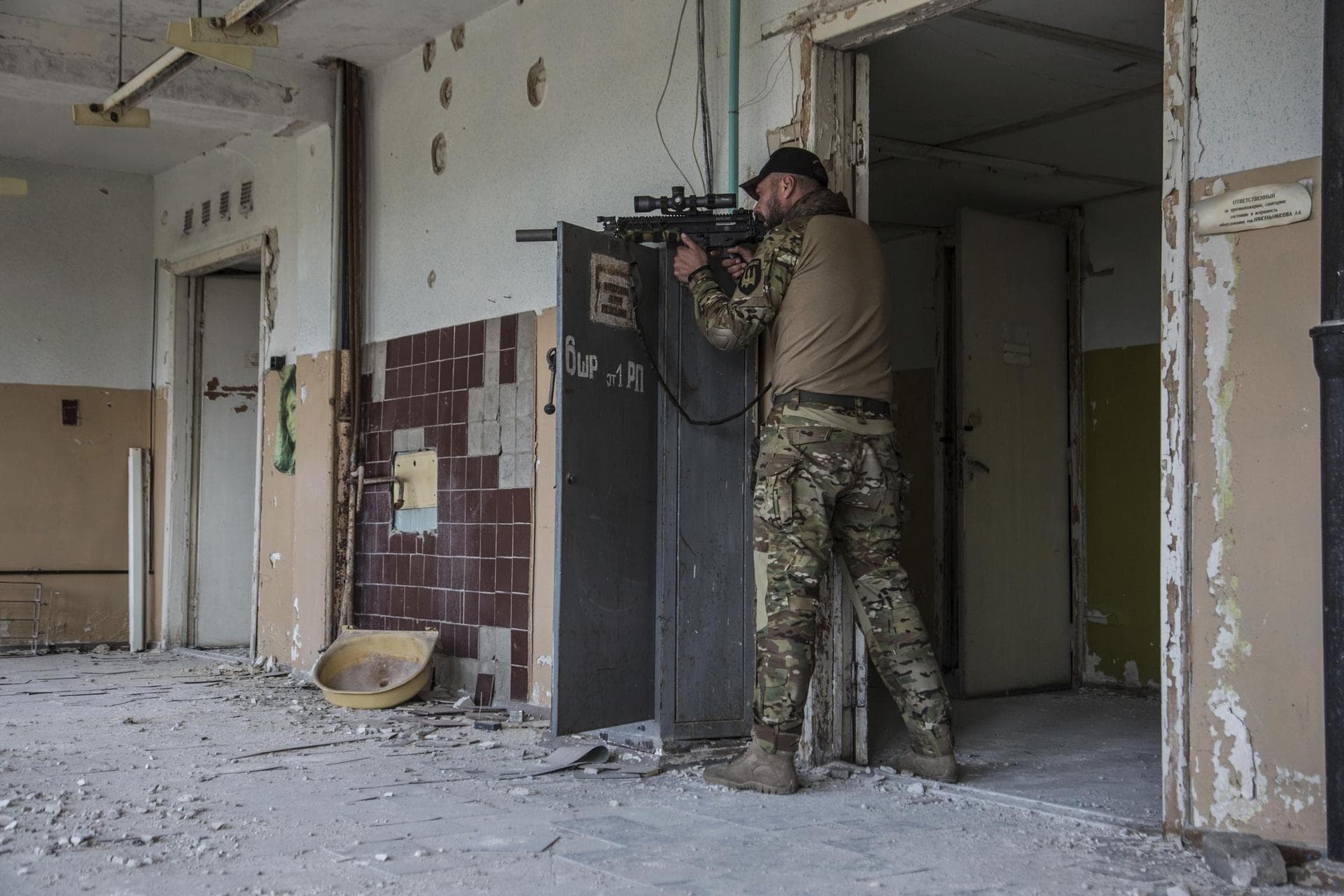 A Ukrainian soldier stands in position during heavy fighting on the front line in Severodonetsk