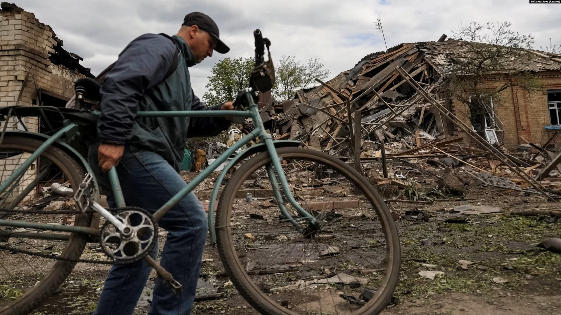 Rescuers work at a site of a residential building damaged by a Russian military strike in Sloviansk