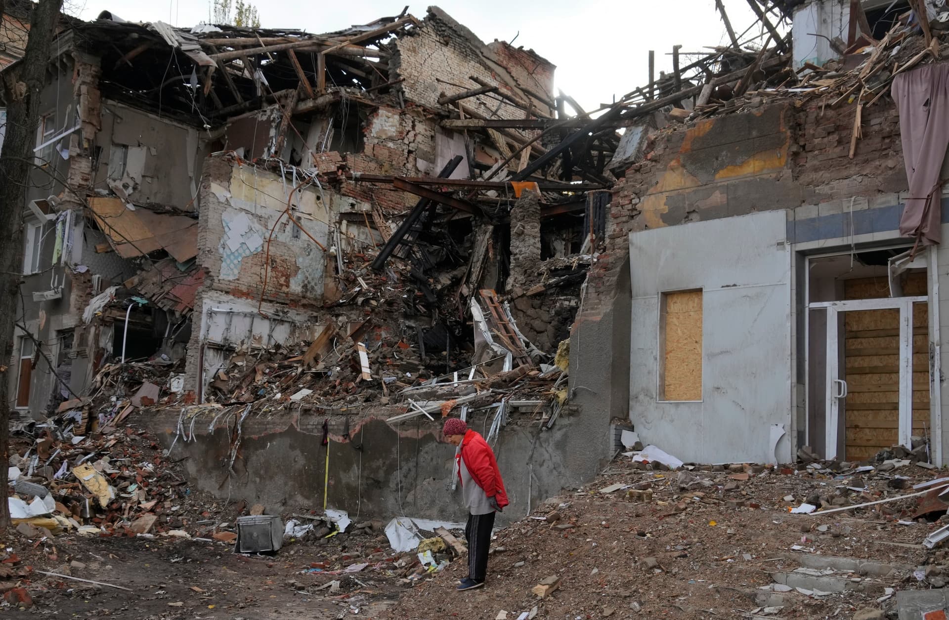 Local resident stands near her house, ruined by the Russian shelling a month ago in central Slavyansk