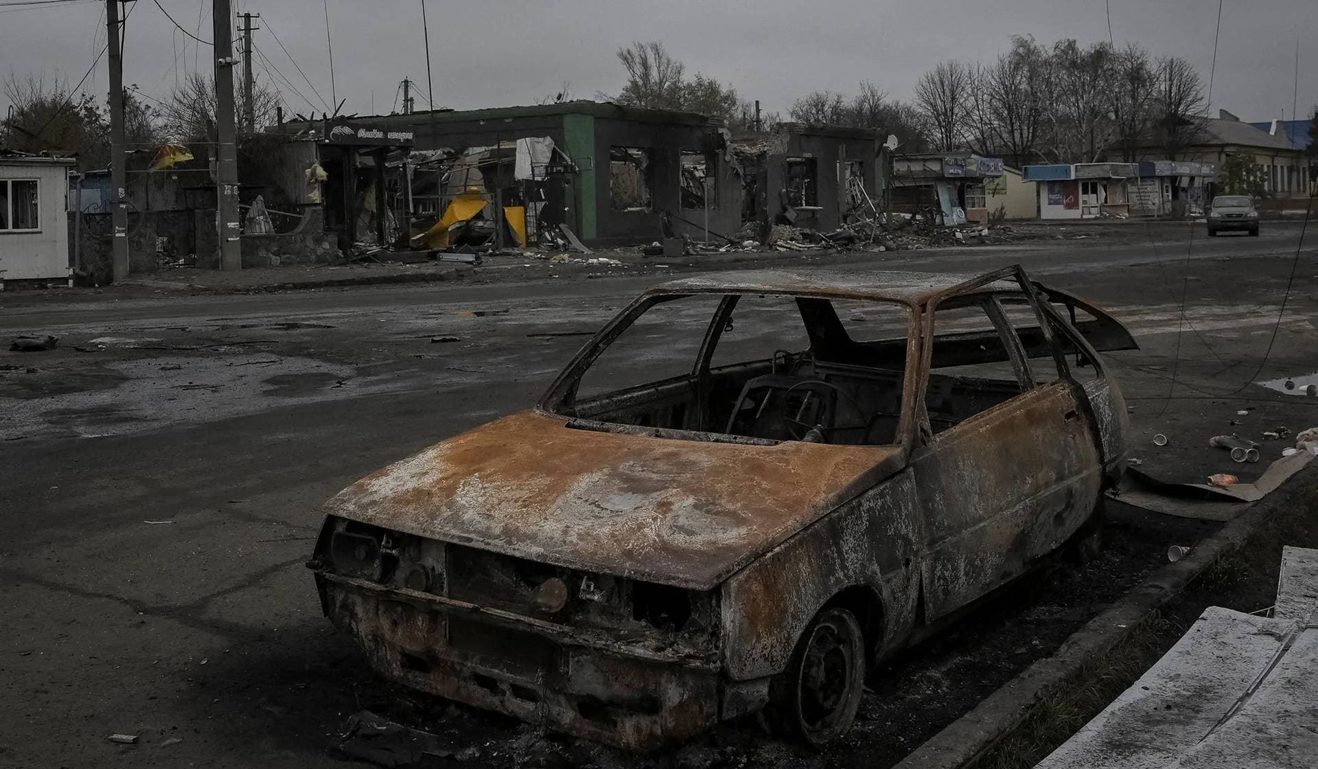 A damaged car lies in the frontline town of Pokrovske