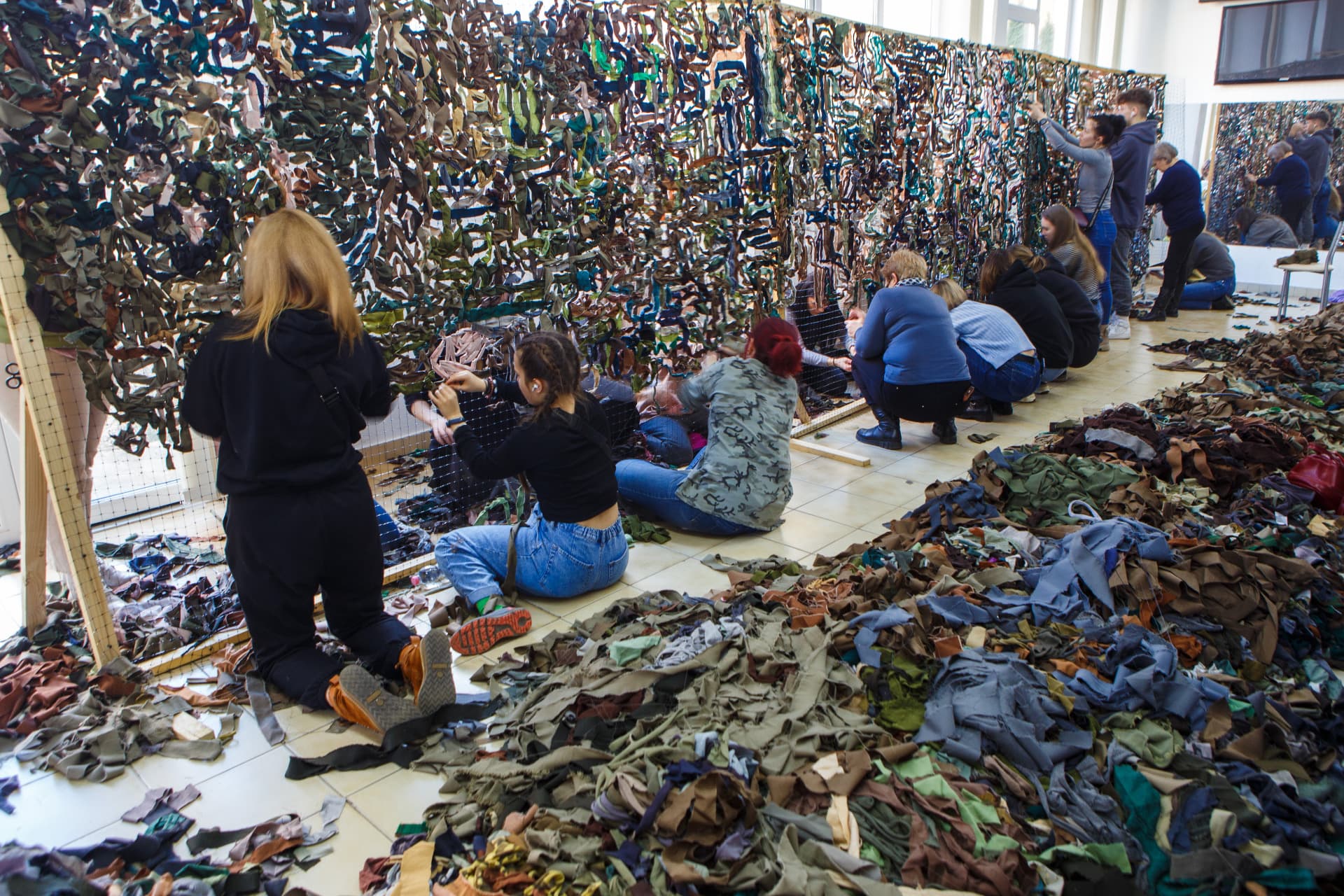 People make camouflage nets for Ukrainian defenders, Uzhhorod