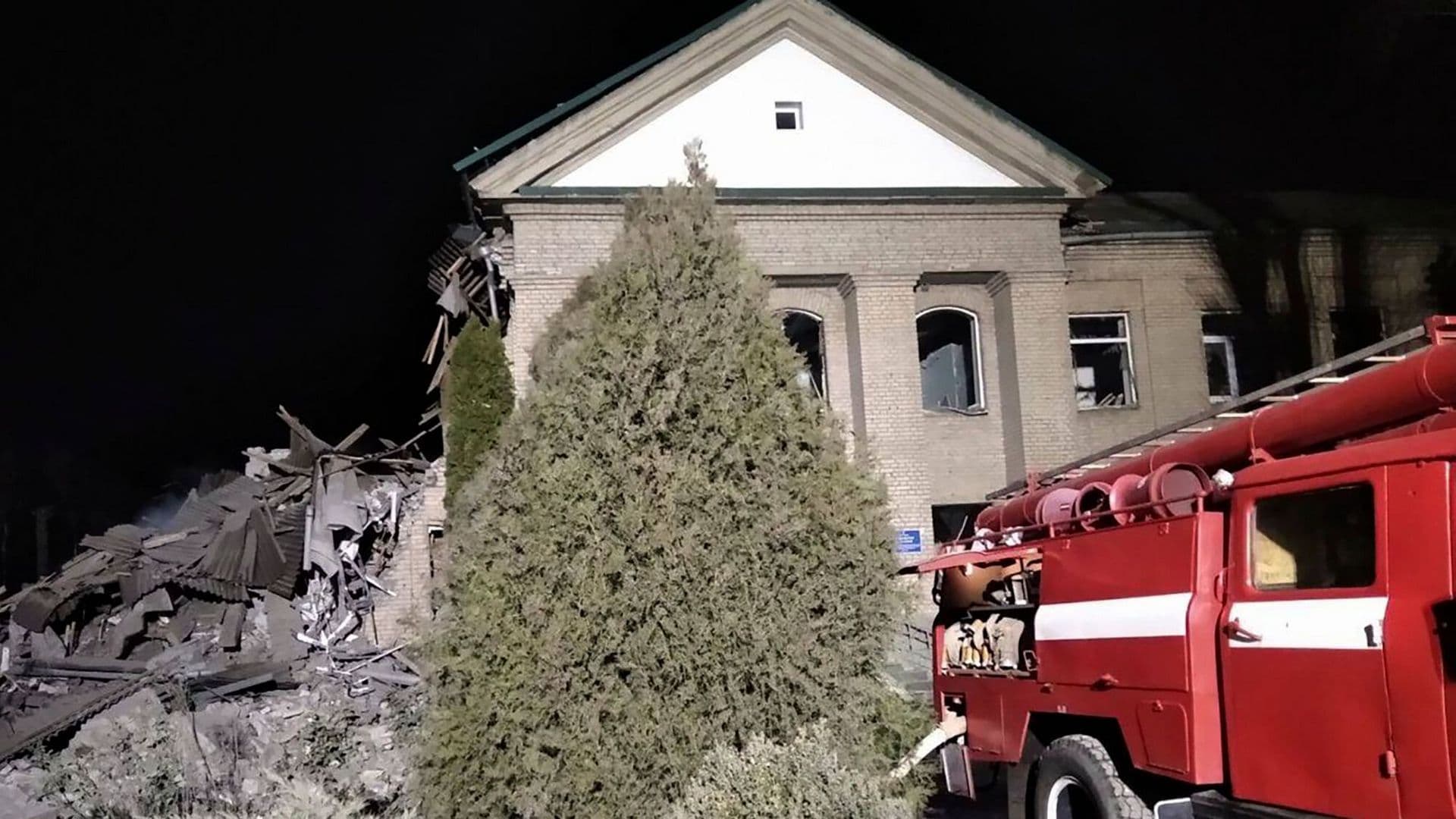 Ukrainian firefighters work at damaged hospital maternity ward in Vilniansk