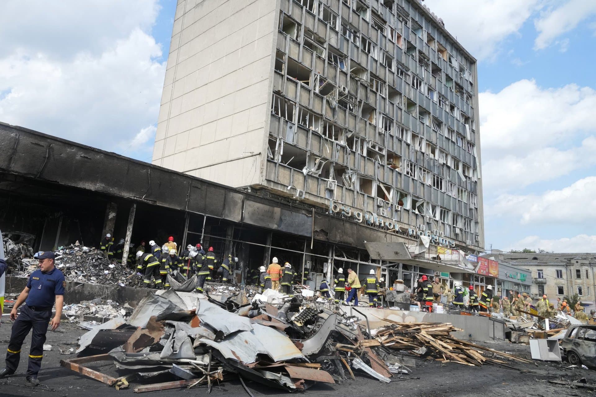 Rescuers work at the scene of a building that was damaged by a deadly Russian missile attack in Vinnytsia