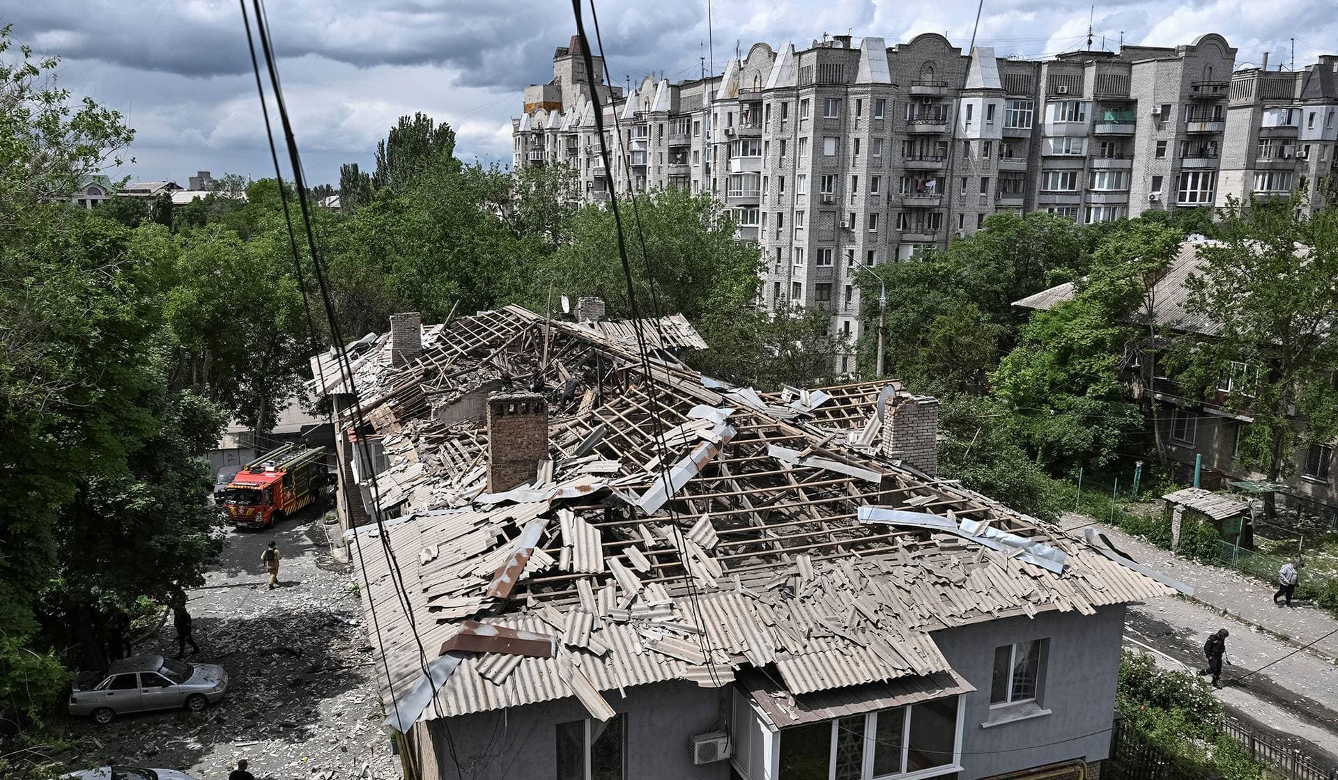 Rescuers work at a site of an apartment building hit by a Russian drone strike in Zaporizhzhia