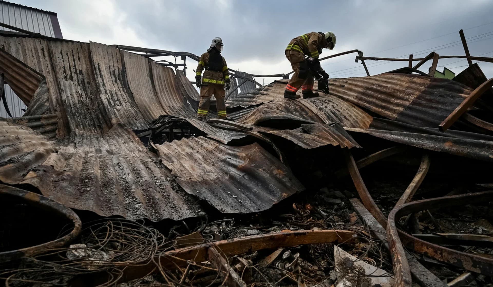 Rescuers work at the site of a Russian military strike in Zaporizhzhia