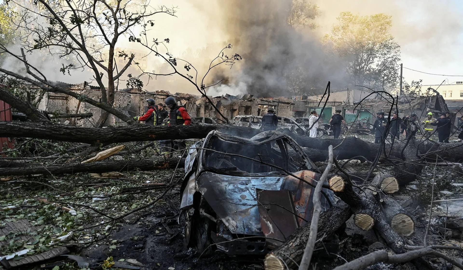 Rescuers work at a site of an apartment building hit by a Russian air strike in Zaporizhzhia