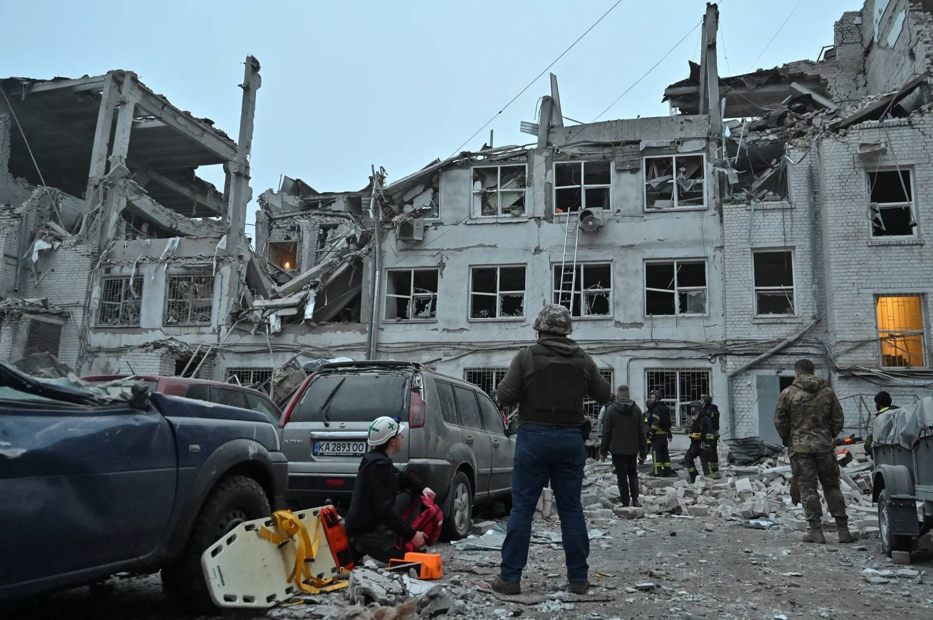 Rescuers work at the site where a building was heavily damaged by a Russian missile strike in Zaporizhzhia