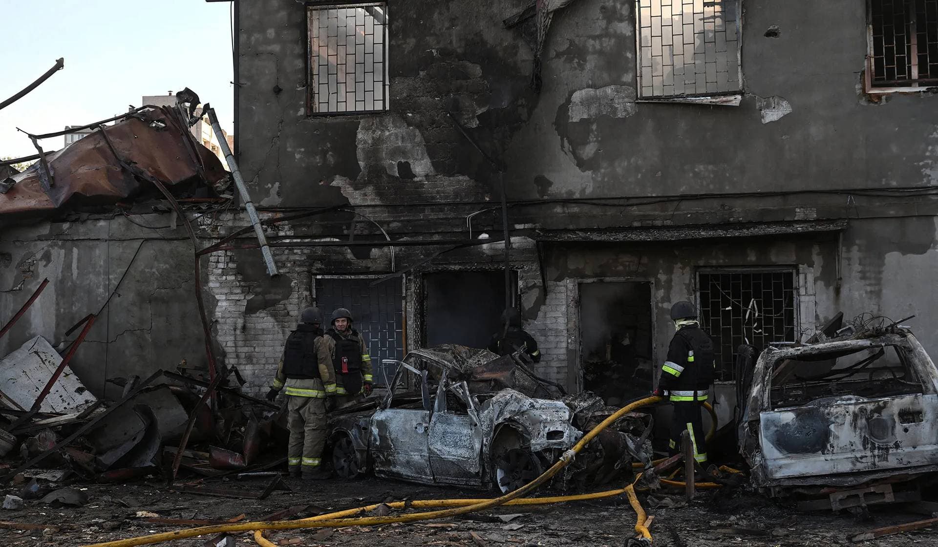 Firefighters work at the site of a private enterprise damaged during a Russian air strike in Zaporizhzhia