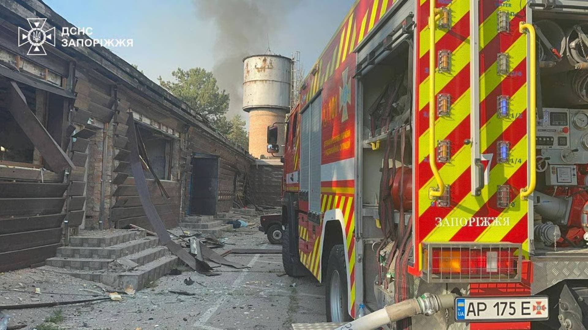 Rescuers work at the site of an apartment building hit by a Russian drone strike in Zaporizhzhia