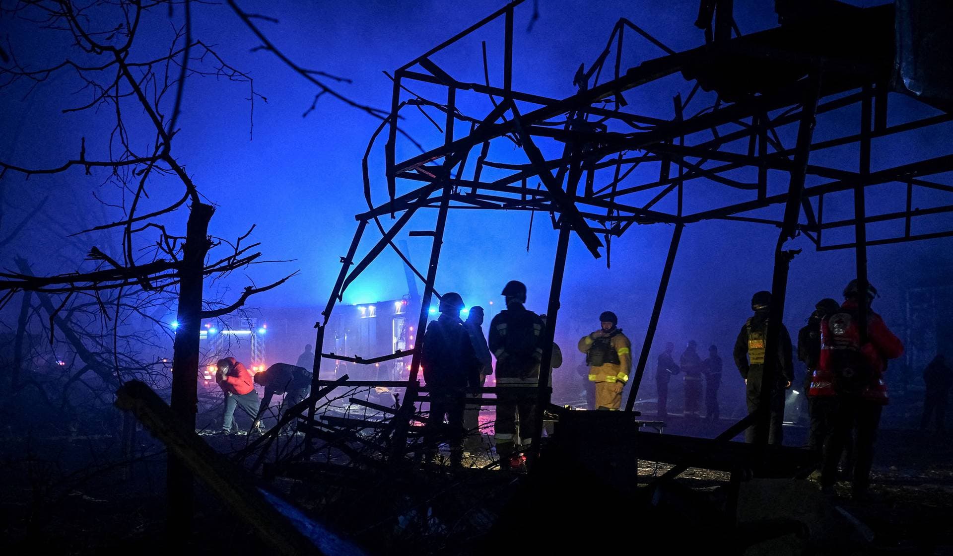 Firefighters work at the site of the Russian air strike in Zaporizhzhia